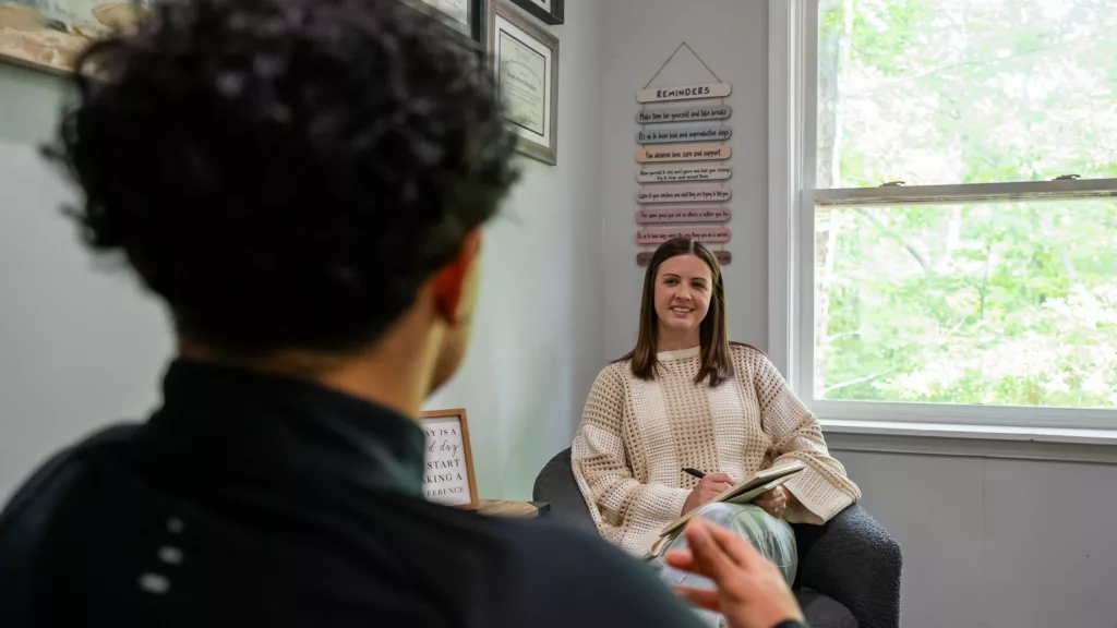 One-on-one counseling session by a window at Eagle Overlook Recovery